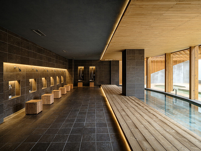 spherical saunas and indirect lighting evoke tranquility within kubo tsushima's spa in japan