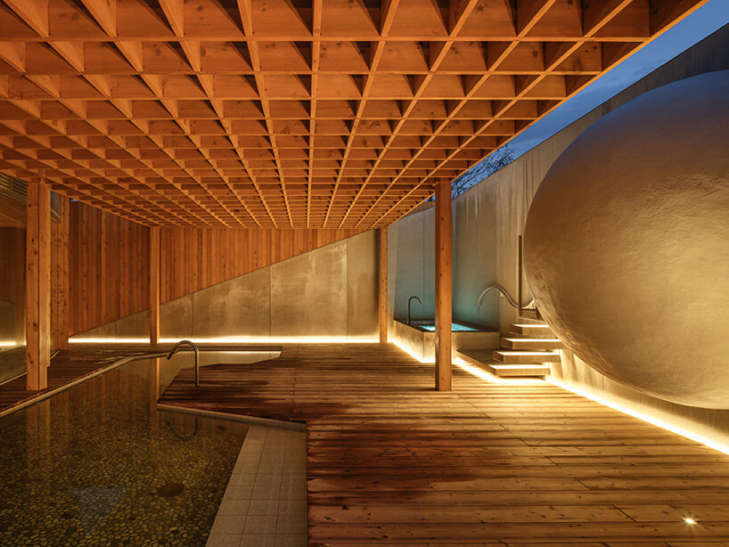 spherical saunas and indirect lighting evoke tranquility within kubo tsushima's spa in japan