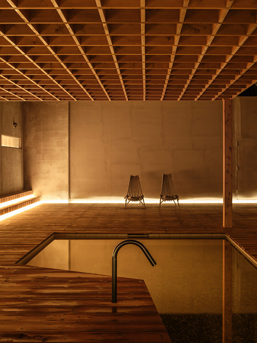 spherical saunas and indirect lighting evoke tranquility within kubo tsushima's spa in japan