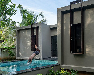 snuggled amongst lush greenery in india, this rustic home is for weekend getaways