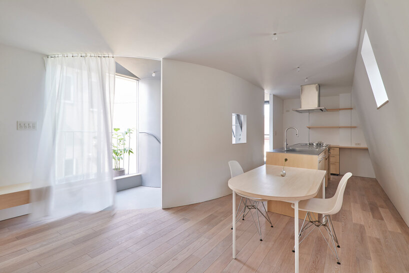 curved metal staircase slices through 'scoop landscape house' in tokyo