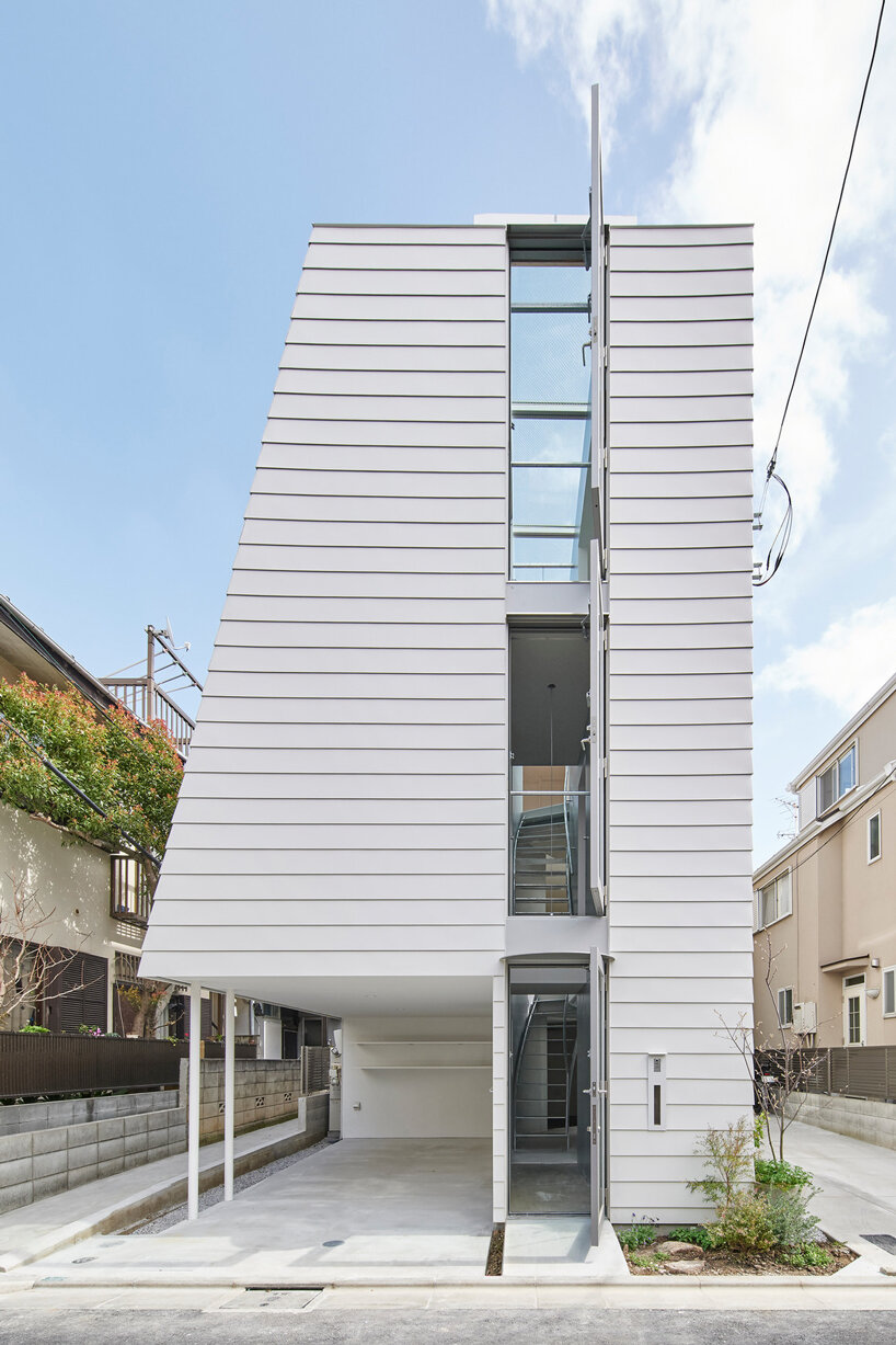 curved metal staircase slices through 'scoop landscape house' in tokyo