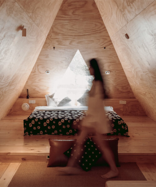 wiki world tops wooden cabin in suburban wuhan with snug, triangular loft