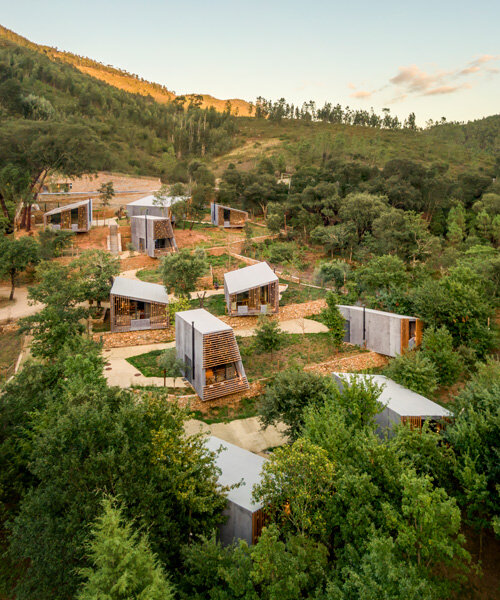 summary architecture scatters tiny hotel cabins over idyllic landscape of paradinha
