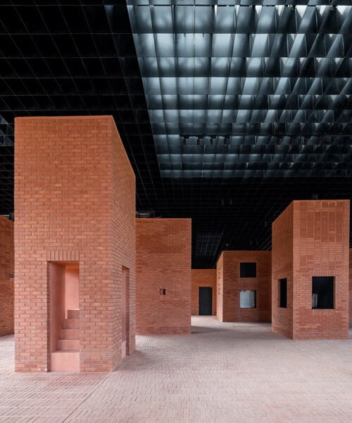 art center of aranya's monolithic brick pavilions offer fragmented views of china's mountains