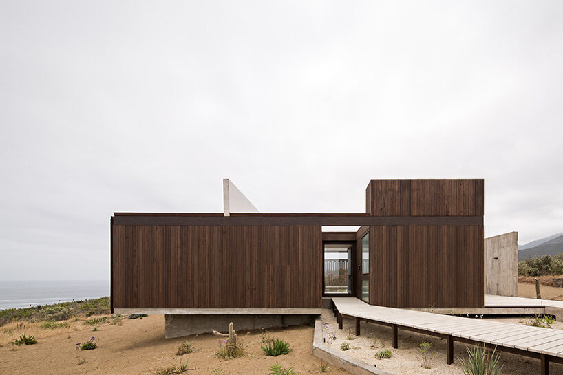 the beach house by juan pablo ureta takes replicas of the rock groups in the chilean natural landscape