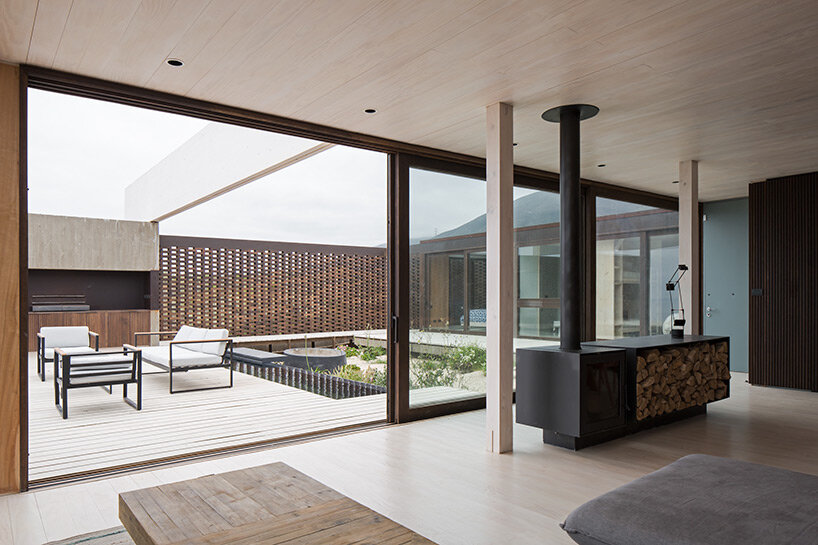 beach house by juan pablo ureta takes cues from rock clusters in chilean natural landscape