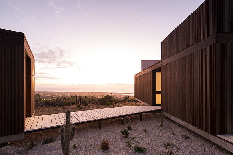 beach house by juan pablo ureta takes cues from rock clusters in chilean natural landscape