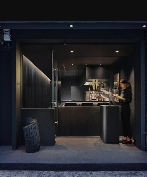 a medley of charcoal textures and tones define the sleek interior of thailand restaurant bar