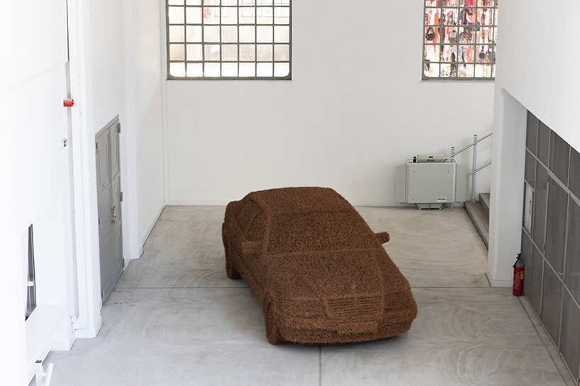 john bock's tentacle sculpture sprawls out of lincoln convertible at 'dream on' exhibition