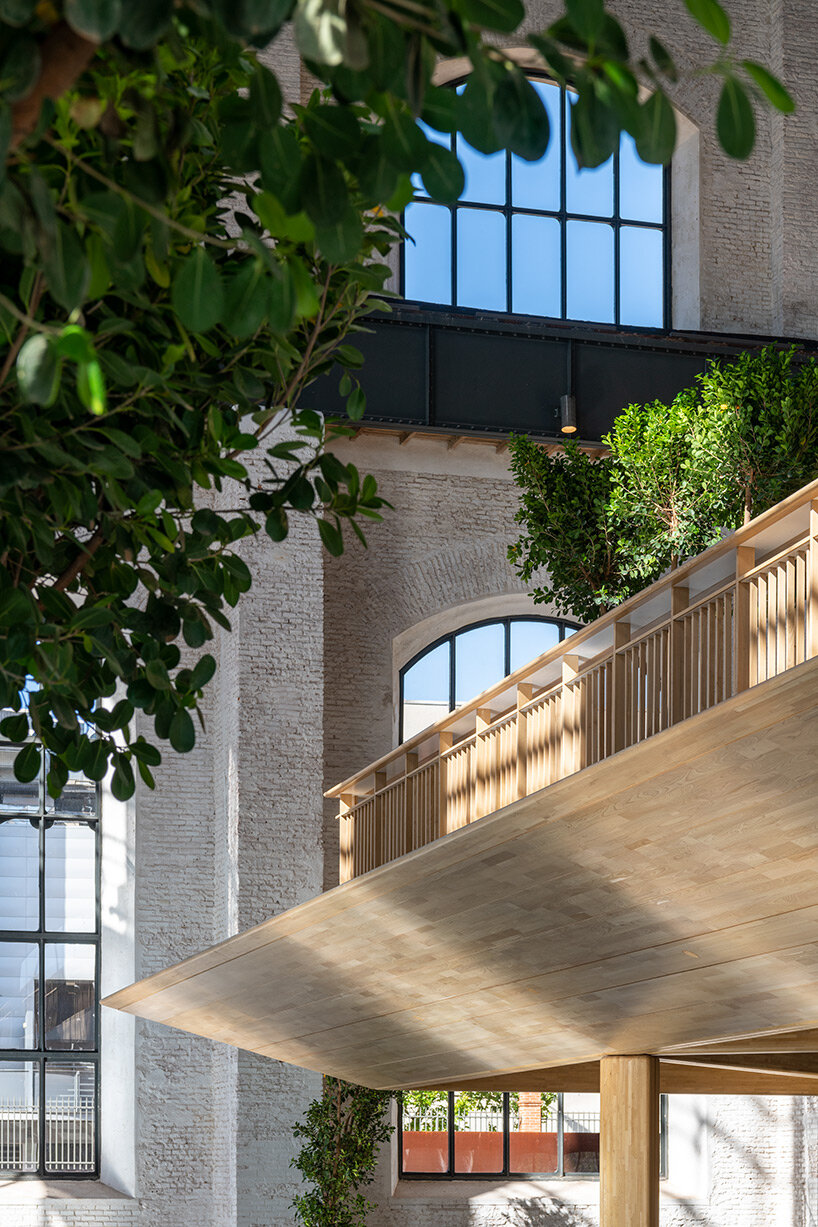 Foster + Partners installs a detachable wooden structure in a disused Madrid gas plant