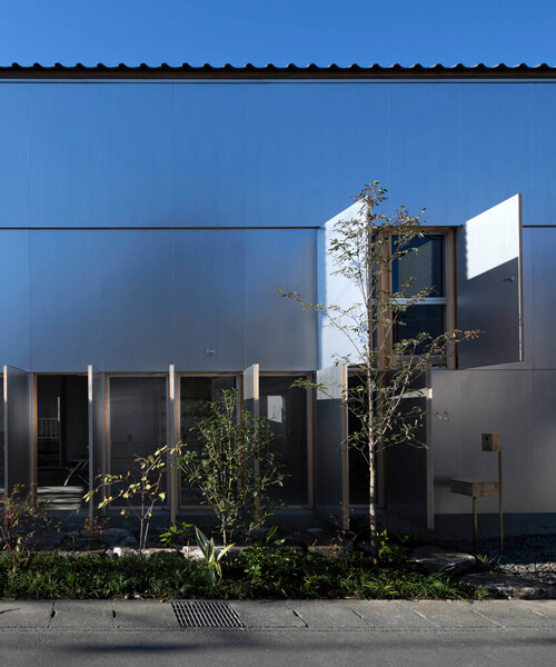 operable silver facade wraps japanese wooden house by seiichi yamada & associates