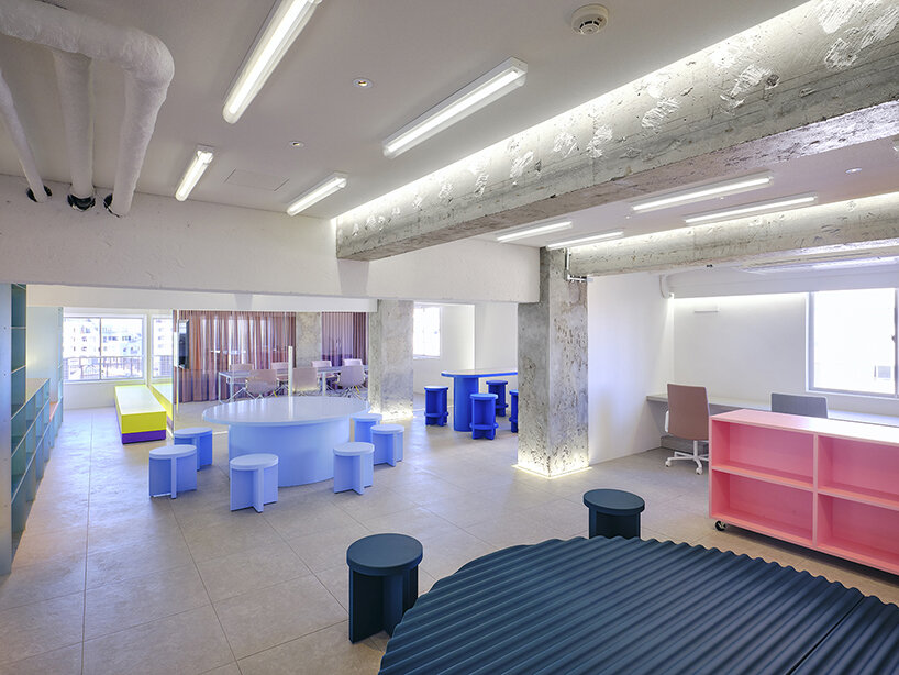 kii injects workspace in tokyo with a satisfying palette of blue, pink, and yellow tones