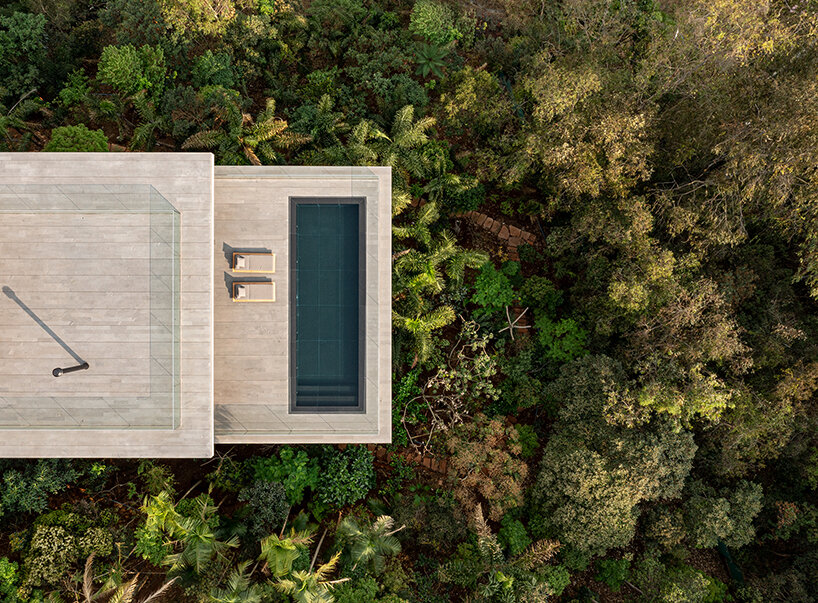 stilted 'minas house' by studio MK27 rests amid rainforest garden in brazil