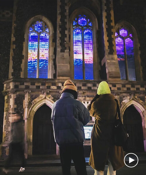 captivating projection of starling murmurations fills windows of converted church in brighton