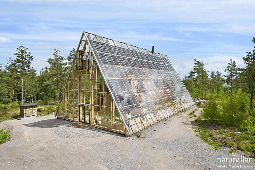 naturvillan is a self-contained, off-grid A-frame greenhouse in Sweden
