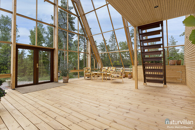 naturvillan is a self-sufficient, off-grid A-frame greenhouse home in sweden