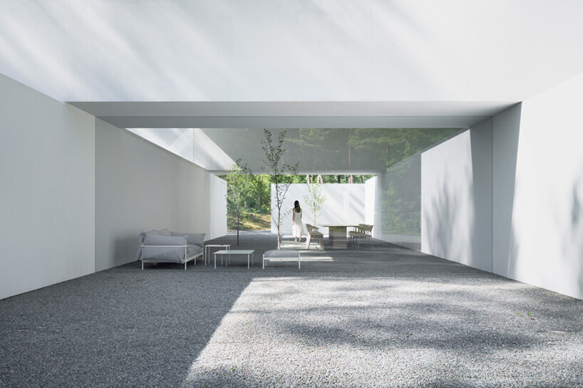 nendo stacks precast concrete culverts to create a minimalist guesthouse in japan