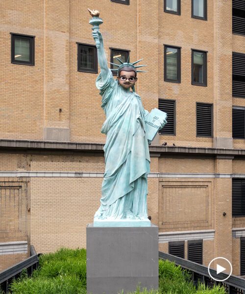 statue of liberty with emoji-inspired mask by paola pivi rises at the high line, NYC