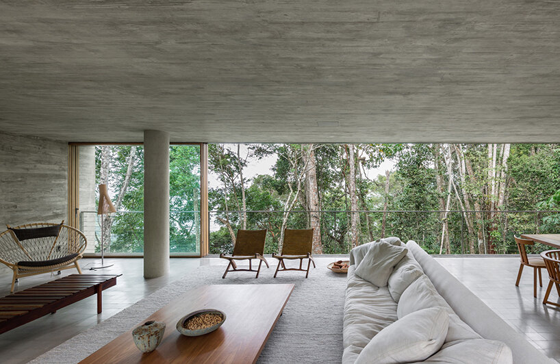 merging two stacked concrete boxes, ‘casa azul’ by studio MK27 fades into the brazilian flora