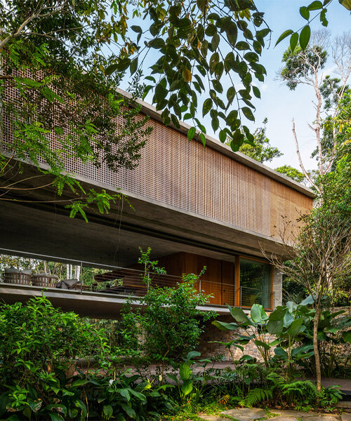 merging two stacked concrete boxes, ‘casa azul’ by studio MK27 fades into the brazilian flora