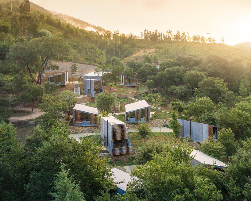 summary architecture scatters tiny hotel cabins over idyllic landscape of paradinha