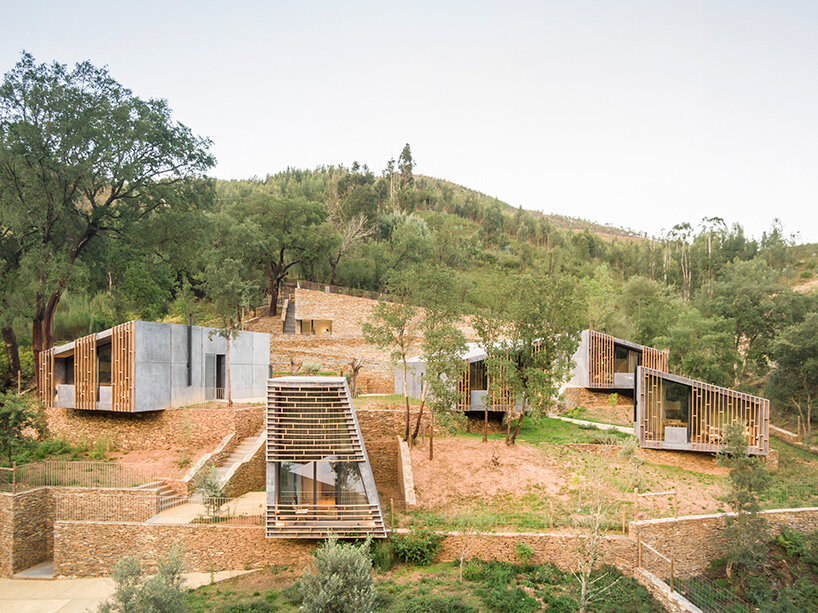 summary architecture scatters tiny hotel cabins over idyllic landscape of paradinha
