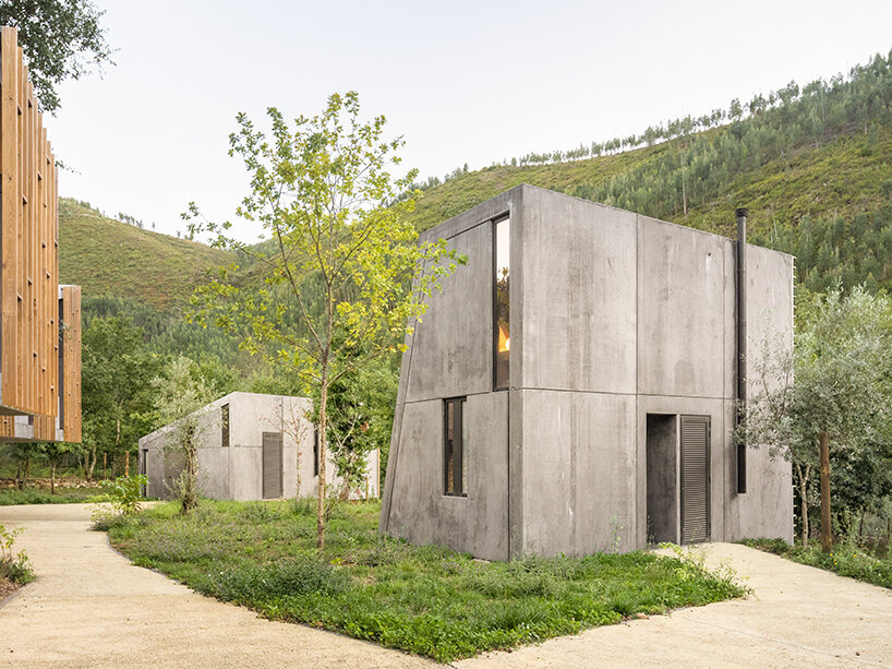 summary architecture scatters tiny hotel cabins over idyllic landscape of paradinha