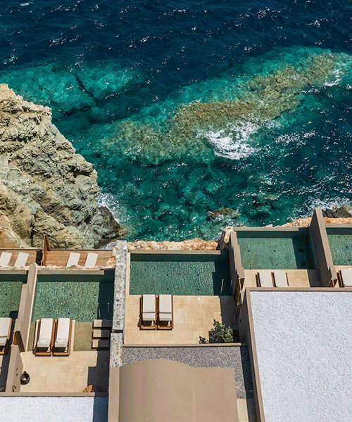 wellness hotel 'acro suites' occupies carved-out caves along coastal cliffs of crete