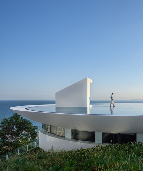 3andwich design's circular 'water drop' library opens toward expansive sea views in china