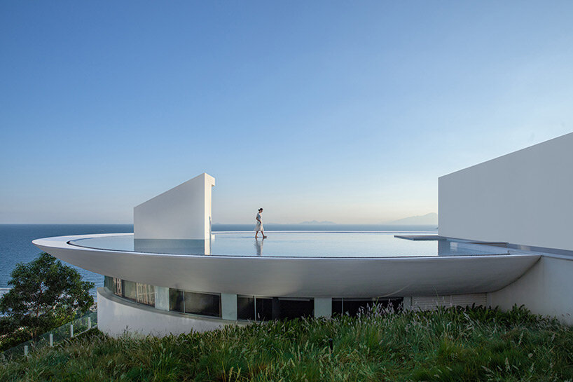 3andwich design's circular 'water drop' library opens toward expansive sea views in china