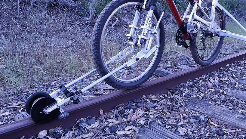 this folding bike accessory allows you to ride on abandoned railways