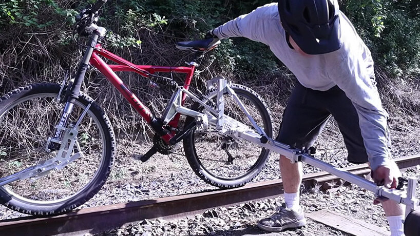 this foldable bike accessory lets you ride on abandoned railways