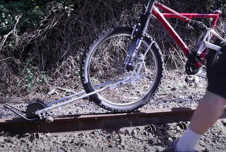 this foldable bike accesssory lets you ride on abandoned railways