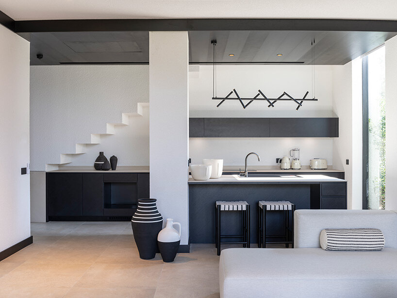 CAJA resort highlights scenic beach in turkey with arrangement of white-washed cubic villas