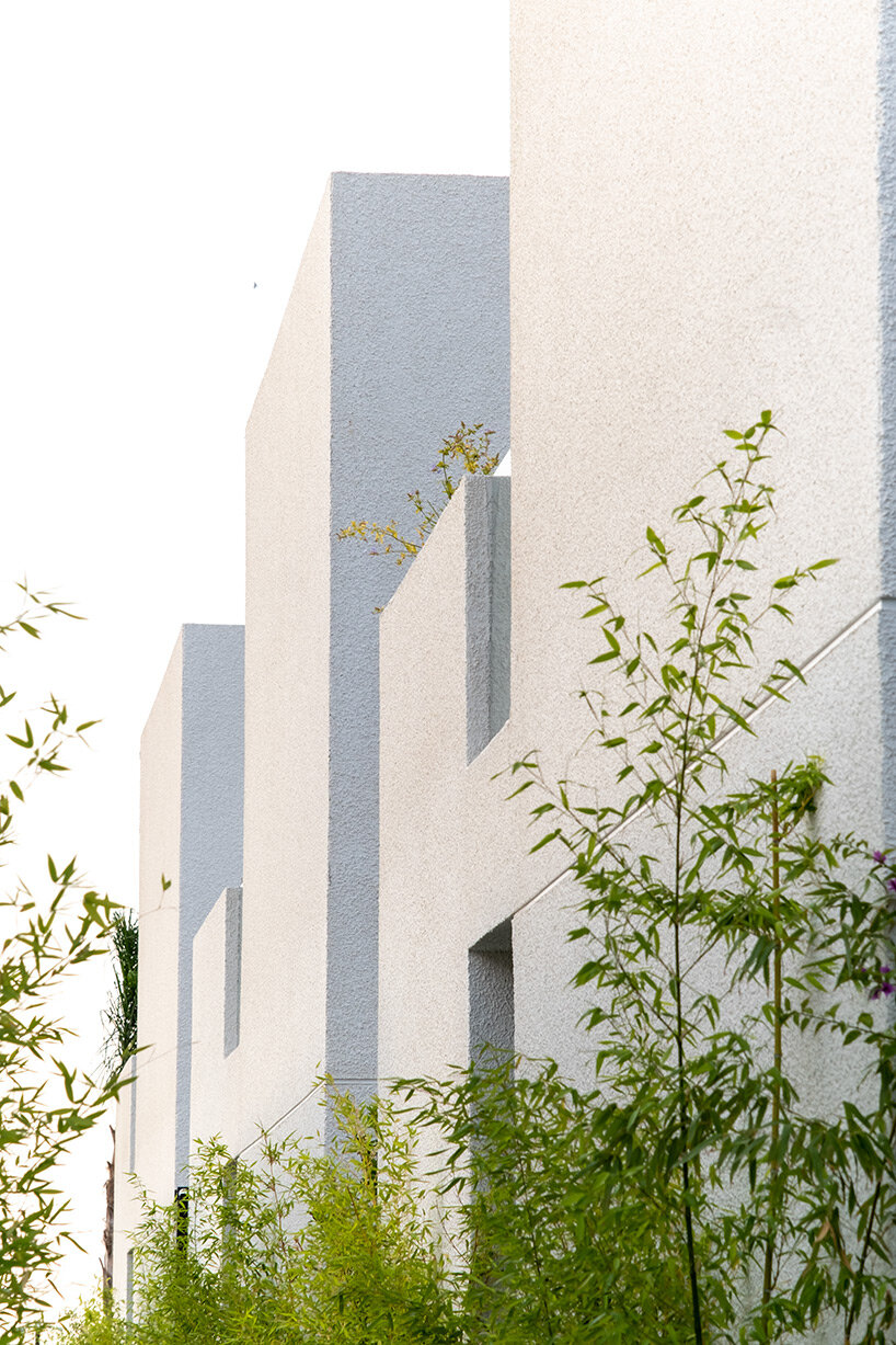 CAJA resort highlights scenic beach in turkey with arrangement of white-washed cubic villas