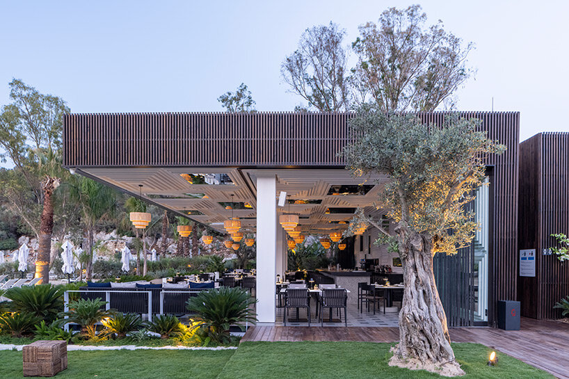 CAJA resort highlights scenic beach in turkey with arrangement of white-washed cubic villas