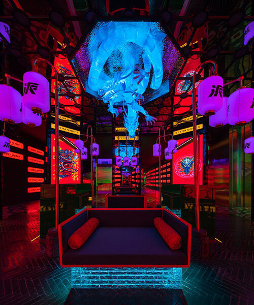 dragon sculpture and eclectic signage illuminate contemporary karaoke lounge in china