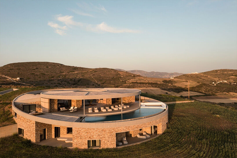 DECA's 'cronus' circular villa nestles into arid island landscape in greece