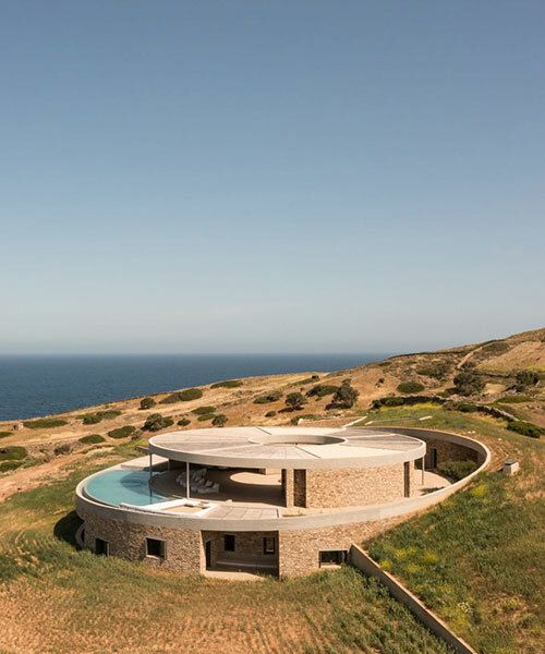 DECA's 'cronus' circular villa nestles into the arid island landscape in greece