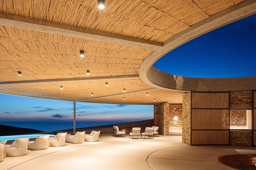 DECA's 'cronus' circular villa nestles into the arid island landscape in greece