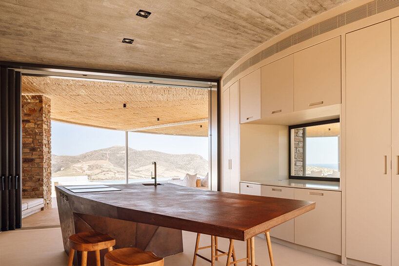 DECA's 'cronus' circular villa nestles into the arid island landscape in greece