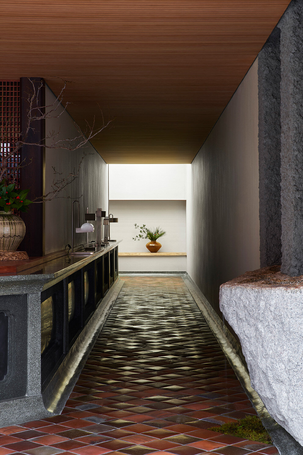 deep eaves with copper shingles protect toru shimokawa's japanese mochi shop from rain