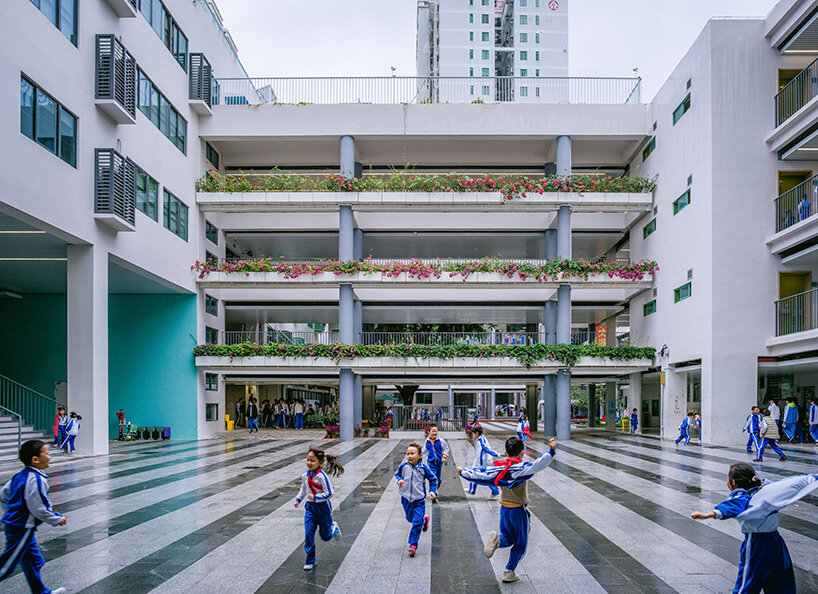 glass classrooms and learning terraces encourage interaction within PAO's school in shenzhen