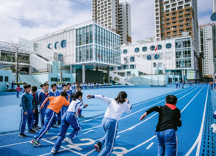 glass classrooms and learning terraces encourage interaction within PAO's school in shenzhen