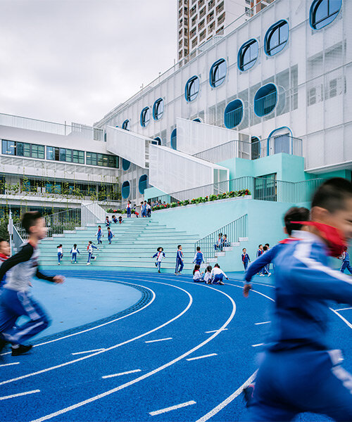 glass classrooms and learning terraces encourage interaction within PAO's school in shenzhen