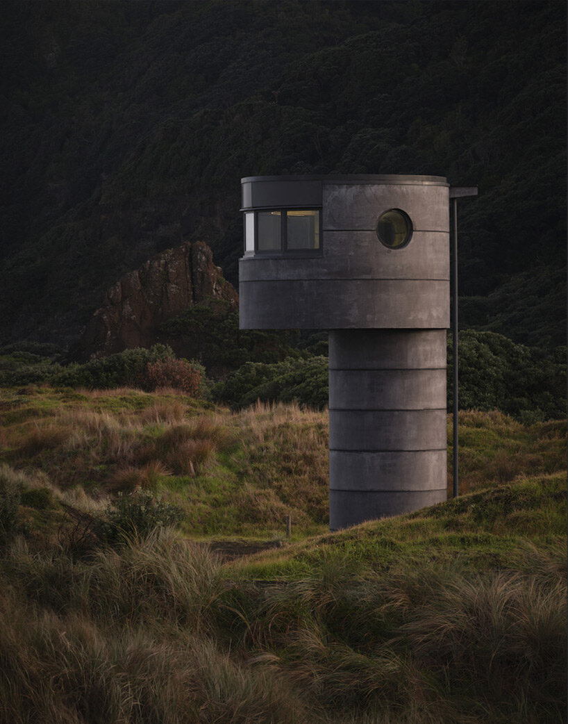 crosson architects perches robust concrete lifeguard tower along tranquil new zealand beach