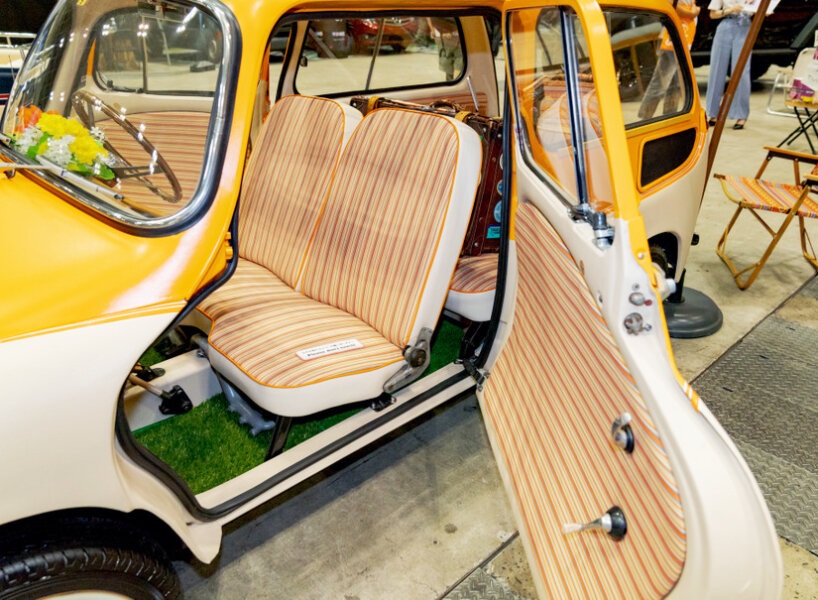 custom subaru 360 beach van oozes summer vibes with its orange hood and retro seats