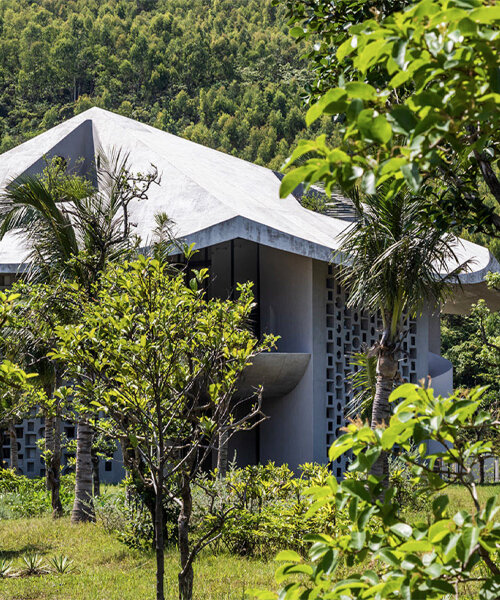 fitted with a conical roof, this living-working hub adapts to the harsh climate of vietnam