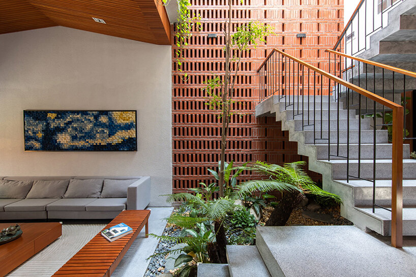 X11 design studio's plant-filled vietnamese house is inspired by paper folds